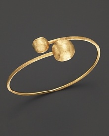 Bold, textured beads anchor this 18K yellow gold bangle. From the Marco Bicego Africa Collection.