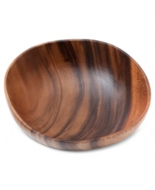 A real natural, the Acacia Wood cereal bowl celebrates the earth's bounty with a rich grain and russet-brown hue. By Marcela for Prima Design.