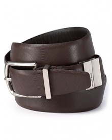 Ingenious design meets classic styling in this unique reversible belt from Michael Kors. Just twist the silver-tone tabs to reverse the belt from black to brown.