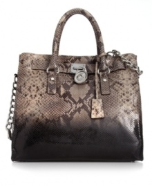 Showcase your penchant for python with this undecidedly posh, leather-embossed design from MICHAEL Michael Kors. Exquisite signature accents in shiny silvertone dress the outside, while the spacious interior provides plenty of pockets to organize your essentials.