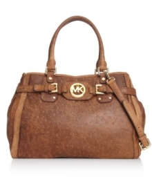 Add a little laid-back luxe to your accessories arsenal with this luscious lovely from MICHAEL Michal Kors. Antiqued leather is bedecked with gleaming hardware and signature detailing, while a plethora or pockets offers superb organization within.