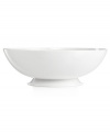 Keep it simple. In glossy white porcelain, this footed serving bowl is a flawless accompaniment to any dinnerware pattern and decor. From Martha Stewart Collection.