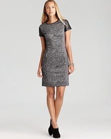 A classic tweed MICHAEL Michael Kors sheath dress gets contemporary edge with edgy zip accents and bullish leather trim. Keep the look modern with sleek heels and minimalist accessories.