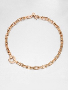 A logo accented nut charm sits off-center on a narrow, chain link design. Rose goldtone brassLength, about 7.6Pendant size, about .75Spring ring closureImported 