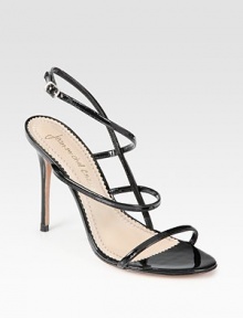 Skinny patent leather straps weave their way around the foot, concluding with an adjustable ankle strap and skinny heel. Self-covered heel, 4 (100mm)Patent leather upperLeather lining and solePadded insoleImported