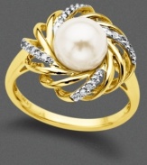 A cocktail ring that is anything but demure. Cultured freshwater pearl (7.5 mm) set against a 14k gold and diamond-accented weave steal the show.