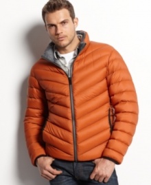 Heat up your cool-weather style with this lightweight, wind and water-resistant puffer coat from Guess.