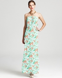 Everyone loves a dress that looks just as good as a cover-up on the beach as it does at a formal garden party, that's why this bright Lilly Pulitzer floral maxi is in high demand with the style set.