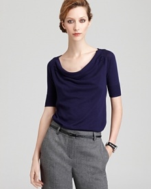 A sophisticated cowlneck Pippa top boasts pleated shoulders and short sleeves for a refined office look.