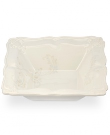 With embossed lilies and golden leaves, Portmeirion's decorated Fleur de Lys salad bowl sets tables in the French tradition. Squared, scalloped stoneware in warm ivory lends distinct old-world elegance to everyday dining.