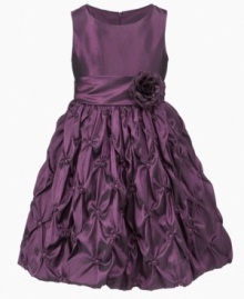 Lovely ruffles layered over the skirt of this rosette dress from Princess Faith give her glamorous look a lift.