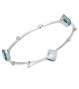 A slim row of sparkle makes a big impact. Victoria Townsend's pretty bangle bracelet slips over the wrist and shines in square-cut blue topaz (10-1/2 ct. t.w.) with diamond accents. Set in sterling silver. Approximate length: 8 inches. Approximate diameter: 2-1/2 inches.