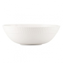 Decorated on the exterior with a twist design that's reminiscent of nautical ropes, this alluring serving bowl offers simple elegance and modern appeal for all your dinner presentations.