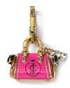 This Juicy Couture charm was made made for handbag-loving ladies. Black bow and rhinestone details mimic the life size style.