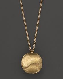 A textured, hand engraved pendant necklace in 18K gold from Marco Bicego.