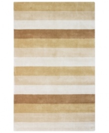 Hand-tufted, blended wool gives an exceptionally soft feel to this rug from the Coastal Treasures collection. In a shimmering, striped design of tan and sand-toned hues, this sophisticated piece adds serene character to every decor.