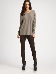 Draped wool and cashmere v-neck has dropped shoulders, long dolman sleeves and a hi-low hem that hits below the hips. V-neckDropped shouldersLong dolman sleevesHi-low hem hits below the hips70% wool/30% cashmereDry cleanImportedModel shown is 5'10 (177cm) wearing US size Small.