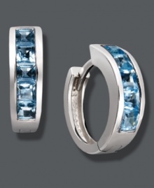 Cool off in blue hues. Baguette-cut blue topaz (2-1/2 ct. t.w.) adds chic, calming color to a traditional pair of hoops. Crafted in sterling silver. Approximate diameter: 1/2 inch.