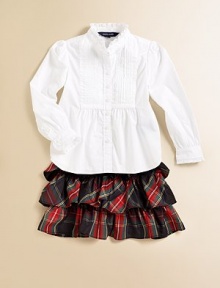 Traditional tartan plaid is crafted into a flirty tiered skirt accented with a flurry of ruffles for a fun, stylish touch.Elastic waistbandTiered ruffle constructionPolyesterDry cleanImported