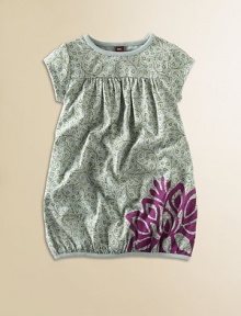 Graceful rambling vines on soft cotton jersey are boldly accented with one big, bright lotus flower at the bubble hem.Round band necklineShort sleevesYoke babydoll bodice with soft gatheringSlight bubble-shaped banded hemPullover stylingCottonMachine washImported