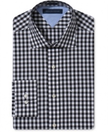 Classic gingham on this slim-fit Tommy Hilfiger dress shirt adds a punch of pattern to your everyday business look.