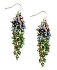 A waterfall of colorful beads from c.A.K.e. by Ali Khan. These drop earrings feature clusters of beetle green glass rondelles in a gold tone mixed metal setting. Approximate drop: 2 inches.