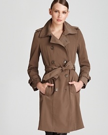 A wardrobe essential, Calvin Klein's double-breasted trench with classic detailing sees you through the seasons in style.