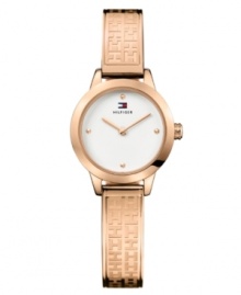 Stamped logos accent the vibrant tone of this bracelet watch by Tommy Hilfiger. Logo-embossed rose-gold-plated stainless steel bangle bracelet and round case. White dial features dot markers at twelve, three, six and nine o'clock, two hands and logo. Quartz movement. Water resistant to 30 meters. Ten-year limited warranty.