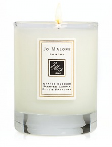 Add the finishing touch to your home by decorating interiors with the refreshingly delicious scent of Orange Blossom. This 2.1 oz. scented travel candle will help create the perfect ambience in any room. Burn time approx. 15 hrs.