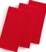 Grab style and keep function with a set of three kitchen towels that step forward in a bright color to wipe up spills, aid in prep and add an accent to your space. The textured design sets a sharp appearance for any room, while the highly absorbent terry quickly cleans up. Limited lifetime warranty.