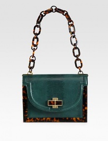 An exotic lizard embossed leather style with glossy resin accents and radiant hardware.Resin chain link shoulder strap, 10 dropMagnetic snap flap closureOne inside zip pocketOne detachable mirrorCotton lining8½W X 6¼H X 3DImported