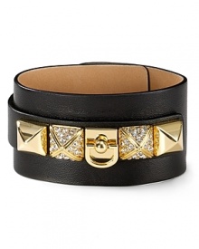 Glamor gets gritty with this leather cuff from Juicy Couture, accented by bold pyramid studs.