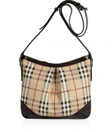 Work an iconic note into your handbag collection with Burberry Londons characteristic checked crossbody bag, perfect for stashing away work and weekend essentials alike - Top zip, logo hardware, belted shoulder strap, inside zippered back wall pocket - Pair with bright knits and favorite skinnies