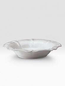 A beautiful stoneware bowl is handcrafted with elegant curves to bring rustic detail and irresistibly romantic European charm to a dinner or party. 80-ounce capacity 5H X 15½ diam. Dishwasher and oven safe Imported