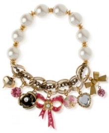 Quite charming. This multi-charm half stretch bracelet from Betsey Johnson is crafted from antique gold-tone mixed metal, and features glass pearls and glistening accents for a whimsical effect. Item comes packaged in a signature Betsey Johnson Gift Box. Approximate length: 7-1/2 inches.