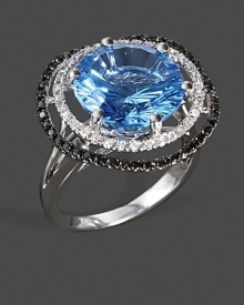 Diamonds and black diamonds frame a faceted blue topaz, set in 14K white gold.