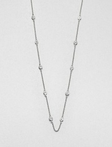 From the Soho Collection. A delicate sterling silver link chain accented with bezel set white sapphire stations. Sterling silverWhite sapphiresLength, about 36Slip on styleImported 