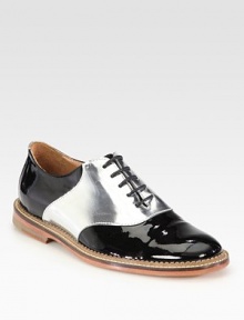 Step out in this easy lace-up design of patent leather, with metallic paneling for a touch of glam. Patent leather upperLeather liningRubber solePadded insoleImported