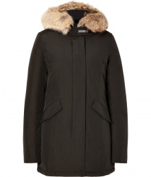 Sporty down-filled in black coated cotton - Classic by cult-label Woolrich, this parka keeps you warm in sub-zero temperatures - Genuine goose-down - snow-tight coating - Cozy, fur-lined hood - Zipper with additional button catch - Sleeves with air-tight cuffs - Great, butt-covering length - Slim and waist-fitted, two lateral pockets - sporty shape - Dream-piece for life, once worn in winter you`ll never part from it again