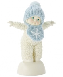 Standing atop a snow mound, this adorable baby boy is about ready to spin. Crafted of porcelain bisque, this Snowbabies figurine makes an adorable gift for any new parent.