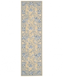 Attractive floral images make this country-style rug a delightful addition to any room. Woven from plush wool, the Country Heritage rug features a muted yellow field, speckled with beautiful blues and whites.