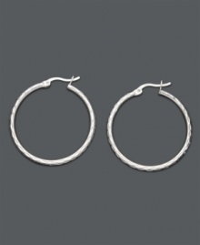 Superior Style. Giani Bernini's chic diamond-cut hoops are a must-have for every girl's collection. Crafted in polished sterling silver. Approximate diameter: 1-1/5 inches.