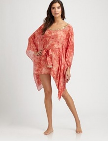 With delicate embroidery, this light-as-air silk coverup is short and definitely sweet.V-neckSelf-tieSilkDry cleanImported