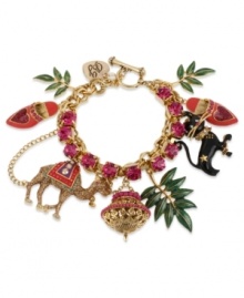 Tropical chic. This Betsey Johnson charm bracelet features a gold tone mixed metal chain with fuchsia-colored crystal cup chain accent, gold tone glitter camel, black cat with gold tone details, gold tone and purple lamp, green leaves and Moroccan style pink shoes. Approximate length: 7-1/2 inches.