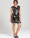 A cascade of sequins lends liquid-like movement to the sleek silhouette of this MICHAEL Michael Kors Plus dress. Finish with metallic accents for a striking ensemble.