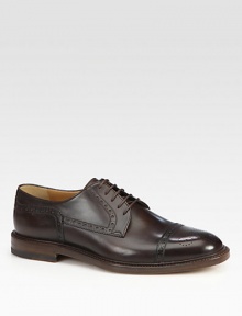 Leather lace-up derby with cap-toe and brogue detailing.Leather soleMade in Italy