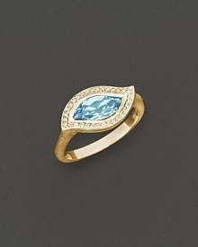 Pavé diamonds frame a faceted blue topaz, set in a 18K gold leaf. By Carelle.