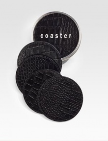 Water-treated coasters are crafted by hand in croco-embossed leather with non-skid bottoms to keep drinks in place and furniture safe. Set of four coasters arrive in a coordinating leather box for presentation and storage. Set of 4 4 diam. Made USA 