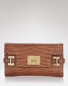 A versatile MICHAEL Michael Kors clutch with glamazon goldtone hardware and organized interior pockets.