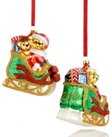 Two fun-loving bears get in the spirit, taking a ride on Santa's sleigh. Stacked with gifts and sparkling with glitter, this Holiday Lane ornament makes every Christmas merry. Shown front and back.